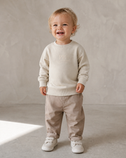 PE Baby Monogram Organic Sweatshirt in Natural Raw - toddler model photograph